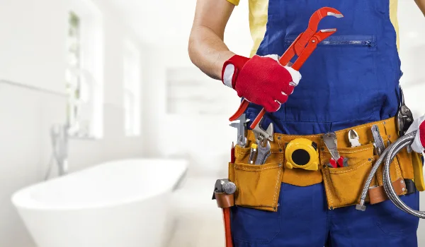 the torso of a plumbing technician showing a tool belt from Emergency Plumber Round Rock in Round Rock, TX - Sewer Line Clearing Services